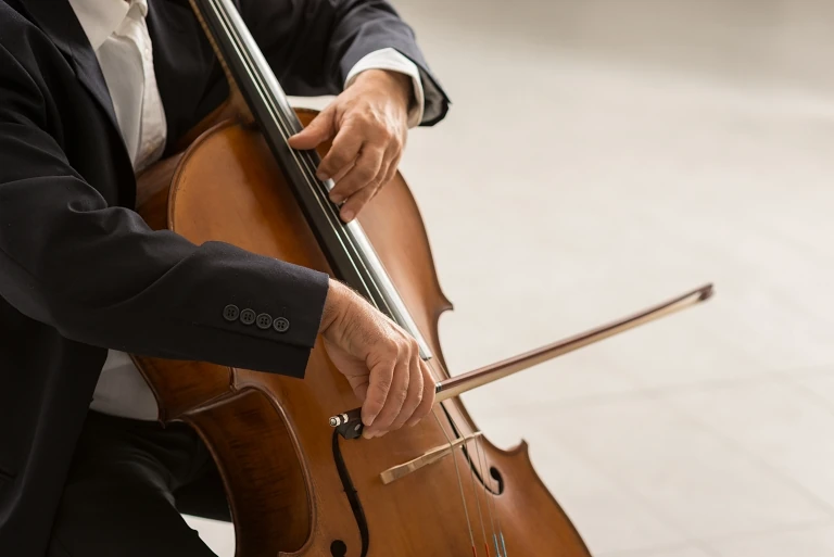 Closeup of man playing the cello